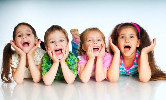 Laughing small kids on a white background
